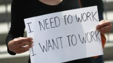 A protester holds a sign that reads, &#39;I need to work, I want to work,&#39; as she joins with restaurant owners, workers and supporters to protest new measures stating restaurants must close their indoor seating to combat the rise in coronavirus cases on July 10, 2020 in Miami, Florida. Restaurant owners in Miami-Dade County say county Mayor Carlos Gimenez&#39;s decision to close restaurant dining halls amid the surge in COVID-19 cases is unfair to them as other businesses stay open. Protest organizers claim there is no clear evidence that closing them is part of a realistic plan that will effectively manage the current crisis in the spread of COVID and they should be able to stay open. (Photo by Joe Raedle/Getty Images)