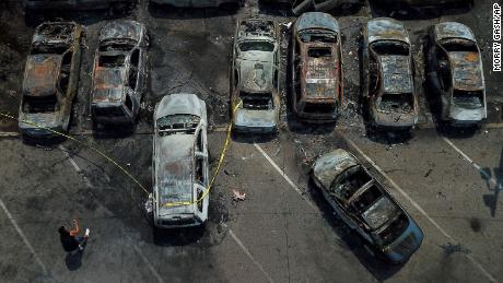 Burned out vehicles are seen August 24 in Kenosha. Many of the cars were set on fire during protests the night before. 