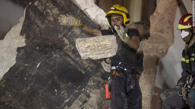 Rescue workers clear rubble from a destroyed building with the aim of finding a potential survivor on September 4, 2020 in Beirut, Lebanon. 
