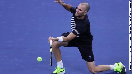 Adrian Mannarino of France returns a volley during his third round match against Alexander Zverev of Germany.