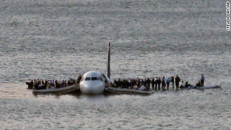 Passengers wait to be rescued on the wings of Flight 1549 after it landed in 2009 in the Hudson River.