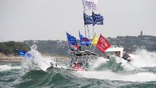 Boats flying flags honoring President Donald Trump crowd Lake Travis during a boat parade Saturday that attracted hundreds of watercraft of all sizes.  Bob Daemmrich for CNN 