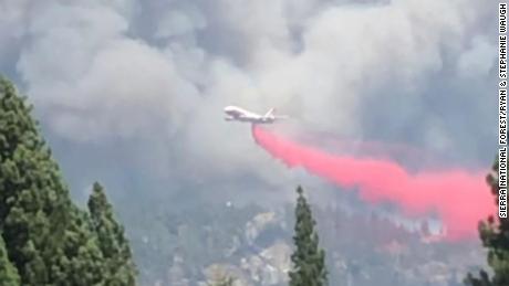 An air tanker drops fire retardant on the wildfire in the Sierra National Forest.