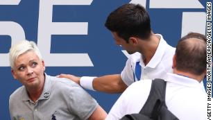 Novak Djokovic of Serbia tends to a line judge who was hit with the ball during his men&apos;s singles match against Pablo Carreno Busta of Spain at the 2020 US Open on Sunday, September 6.