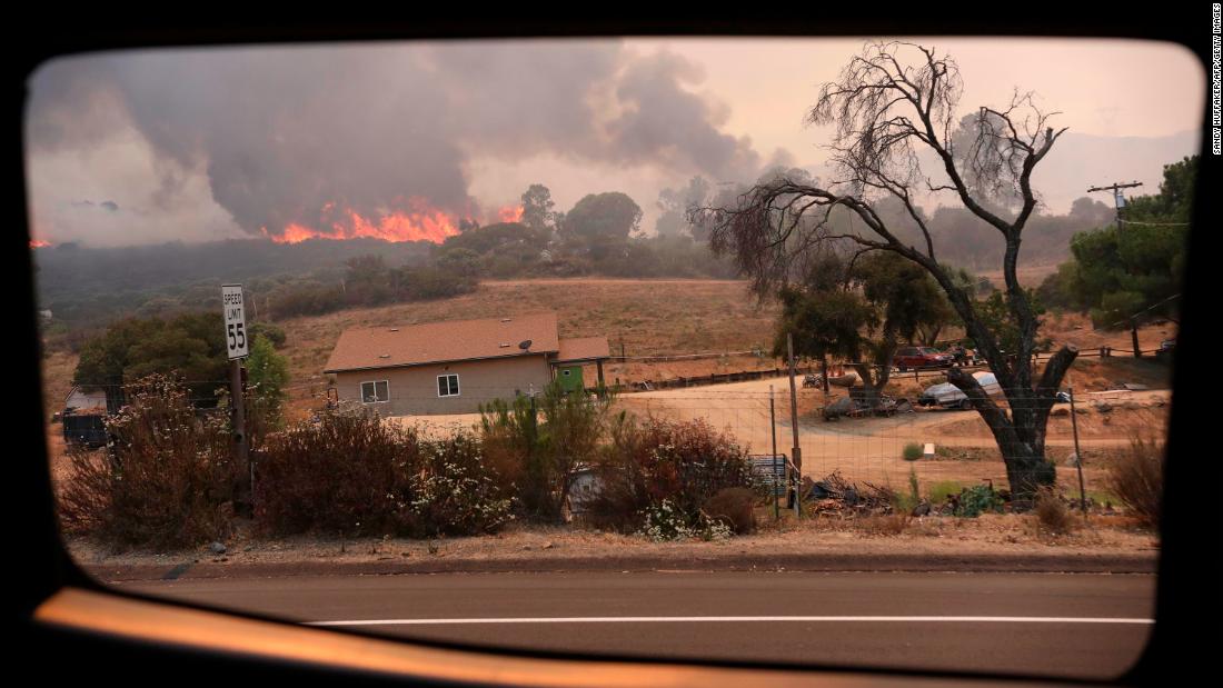 A fire encroaches Japatul Road in Jamul on September 6, 2020.