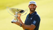 Johnson celebrates with the FedEx Cup trophy.