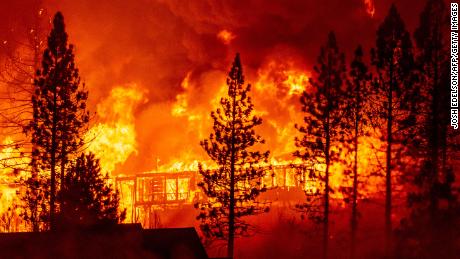 A home is engulfed in flames during the &quot;Creek Fire&quot; in the Tollhouse area of unincorporated Fresno County, California early on September 8, 2020. 