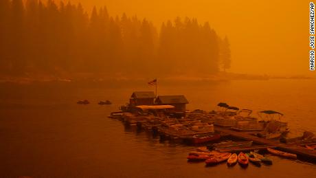 Smoke from the Creek Fire fills the air over a boating dock, Sunday, Sept. 6, 2020, in Shaver Lake, Calif. 