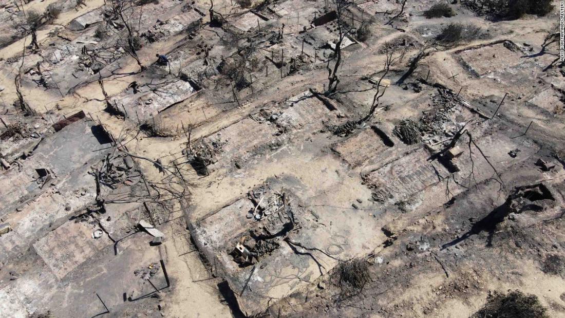 An aerial view shows destroyed shelters.
