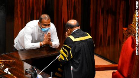 Convicted murderer Premalal Jayasekara bows after he is sworn in as a member of Sri Lanka&#39;s parliament in Colombo on September 8, 2020.