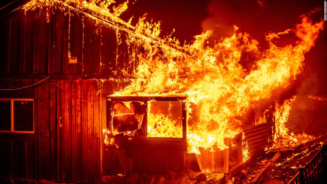 Flames shoot from a home in Butte County.