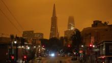 Looking up Columbus Avenue, the Transamerica Pyramid and Salesforce Tower are covered with smoke from wildfires late Wednesday morning on Wednesday, September 9, in San Francisco.