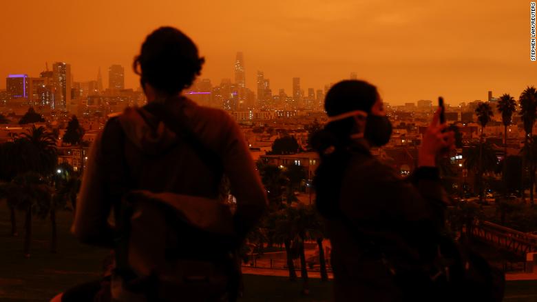 Visitors are seen in Dolores Park under an orange sky &lt;a href=&quot;https://www.cnn.com/2020/09/09/weather/california-orange-skies-wildfires-photos-trnd/index.html&quot; target=&quot;_blank&quot;&gt;darkened by smoke from California wildfires&lt;/a&gt; in San Francisco on Wednesday. 