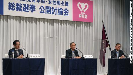 Japanese Chief Cabinet Secretary Yoshihide Suga (center) speaks during an online debate for the ruling Liberal Democratic Party&#39;s presidential election alongside former Foreign Minister Fumio Kishida (left) and former Defence Minister Shigeru Ishiba on Wednesday.