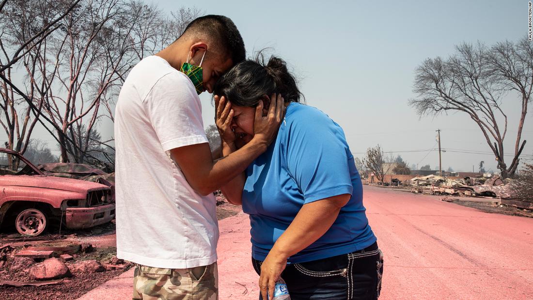 Dora Negrete is consoled by her son Hector Rocha after seeing their destroyed mobile home in Talent, Oregon, on September 10.