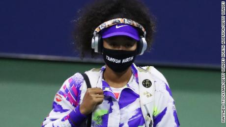 Osaka walks out wearing a mask with Martin&#39;s name before taking on Anett Kontaveit.