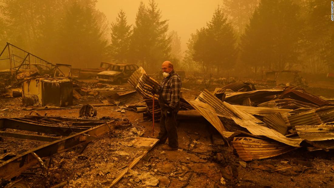 George Coble walks through his destroyed property in Mill City, Oregon, on September 12, 2020.