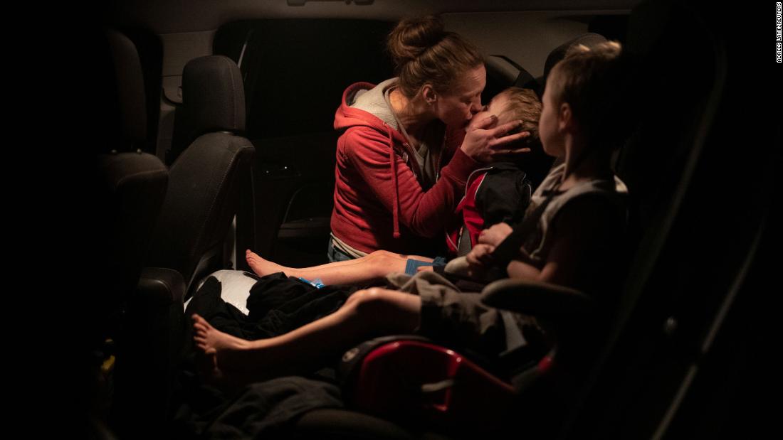 Crystal Sparks kisses her 4-year-old twins, Chance and Ryder Sutton, as they escape the Obenchain Fire in Butte Falls, Oregon, on September 11.