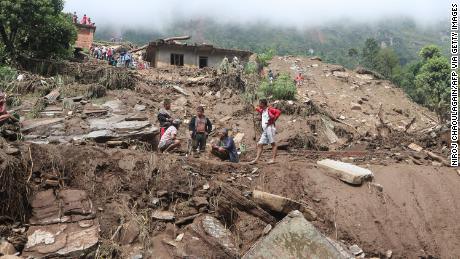 Residents and rescue workers search for landslide victims in Sindhupalchok District.