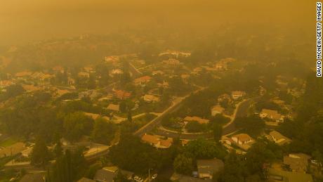 An aerial view shows neighborhoods in Monrovia, California shrouded in smoke as the Bobcat Fire advanced on September 13.