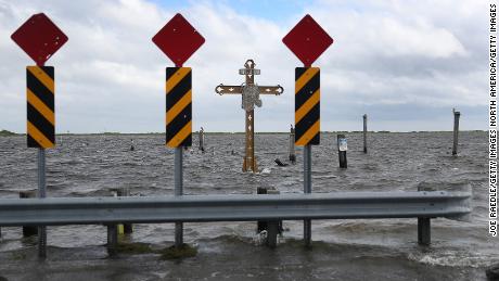  A cross honoring those killed by Hurricane Katrina stands in the Mississippi River-Gulf Outlet before the arrival of Hurricane Sally.