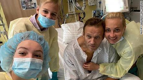 Alexey Navalny sits up in his hospital bed earlier this month. 