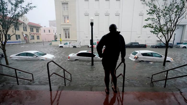 Floodwaters surround cars Wednesday morning in Pensacola, Florida.