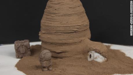 A simple manufacturing technology based on chitin, one of the most ubiquitous organic polymers on Earth, could be used to build tools and shelters on Mars, according to a study published Wednesday. Pictured: A model of what a Martian habitat made from the material could look like.