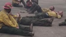 Exhausted firefighters sing together after a 14-hour shift battling wildfires in Oregon 