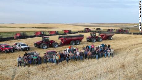 Around 60 neighbors, friends and family of a North Dakota farmer harvested his wheat and canola  after the farmer suffered a heart attack during harvest.