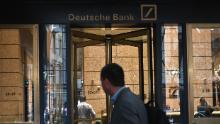 A man is seen outside the US headquarters of Deutsche Bank on July 8, 2019 in New York City. - From Asia to the United States, disconsolate staff at Deutsche Bank dealt Monday with news of massive layoffs with some already heading to the exits to drown their sorrows.The German giant&#39;s share price fell to a low of 6.66 euros ($7.47) before closing down 5.4 percent at 6.79 euros, following Sunday&#39;s announcement of 18,000 job losses by 2022 as the company transitions out of high-risk investment banking. (Photo by Angela Weiss / AFP)        (Photo credit should read ANGELA WEISS/AFP via Getty Images)