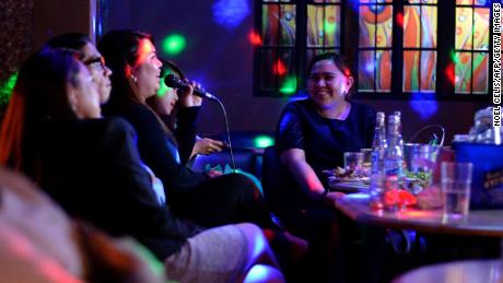 Customers sing karaoke at a nightclub in Davao City, Mindanao Island, in the southern Philippines, on May 10, 2016.
