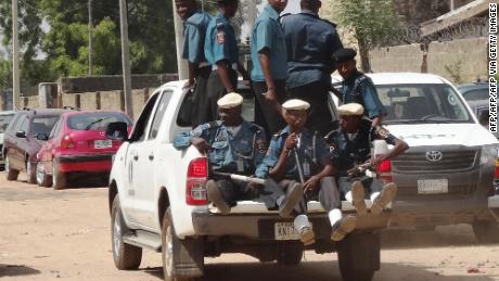 A team of Sharia law enforcers known as the Hisbah Corps patrols the streets of Kano in October 2013.  