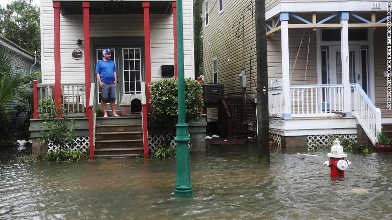 See flooded streets, widespread damage in Sally's path