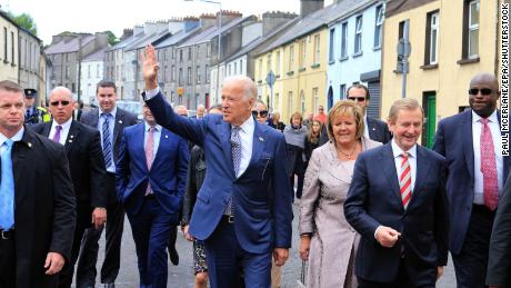 Joe Biden (center) with then Irish Taoiseach Enda Kenny (second from right) on a visit to Ballina, in Ireland&#39;s County Mayo, in June 2016.