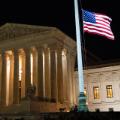 The American flag flies at half staff following the death of U.S. Supreme Court Justice Ruth Bader Ginsburg, outside of the U.S. Supreme Court, in Washington, U.S., September 18, 2020. REUTERS/Al Drago