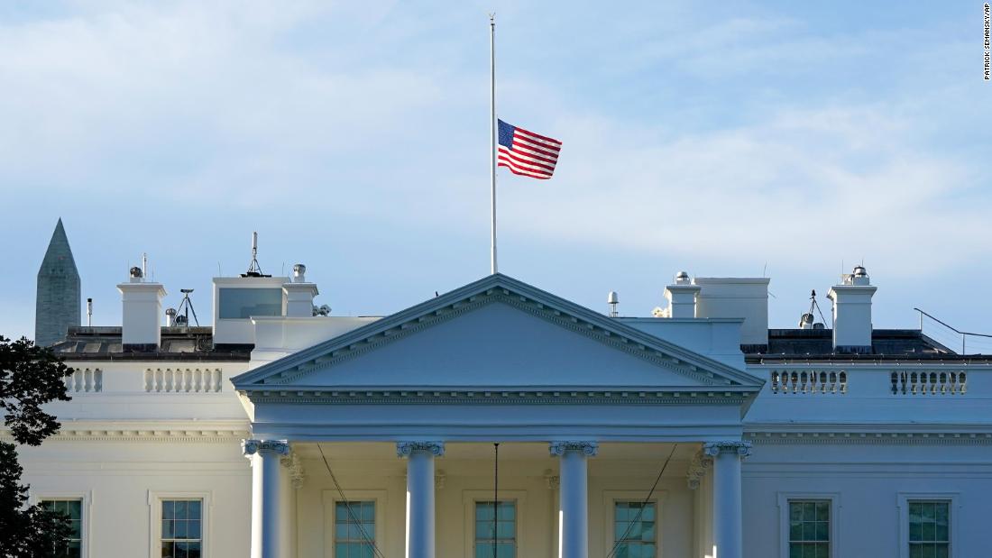 The American flag flies at half-staff over the White House on September 19.