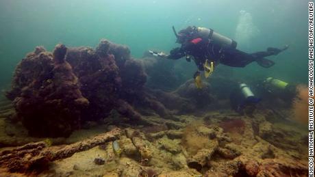 Divers swim near the wreck of &quot;La Union,&quot; which carried Mayan people for slave trade in the 1850's, off the coast of Sisal, Yucatan, Mexico.