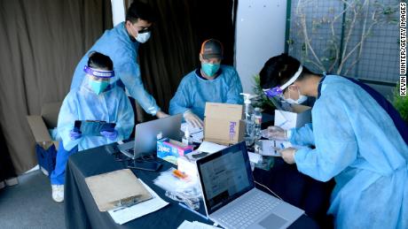 Health workers were performing Covid-19 tests for students and faculty at the University Prep Value High School in Los Angeles.