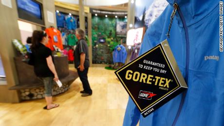 A coat sits on display as sellers and buyers look over gear at the Gore-Tex booth during the Outdoor Retailer Summer Show at the Salt Palace in Salt Lake City, Utah, Friday August 3, 2012. 