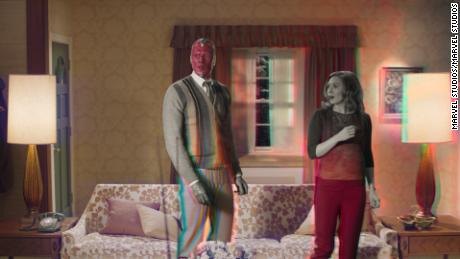 Paul Bettany (left) is Vision and Elizabeth Olsen (right) is Wanda Maximoff in Marvel Studios' &quot;WandaVision.&quot; 