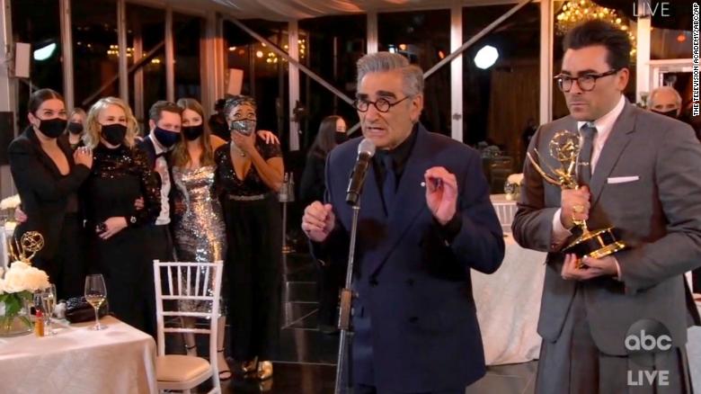 Annie Murphy, from left, Catherine O&#39;Hara, Noah Reid, Sarah Levy, Karen Robinson, Eugene Levy and Daniel Levy accept the award for outstanding comedy series for &quot;Schitt&#39;s Creek&quot; during the 72nd Emmy Awards broadcast. (The Television Academy and ABC Entertainment via AP)