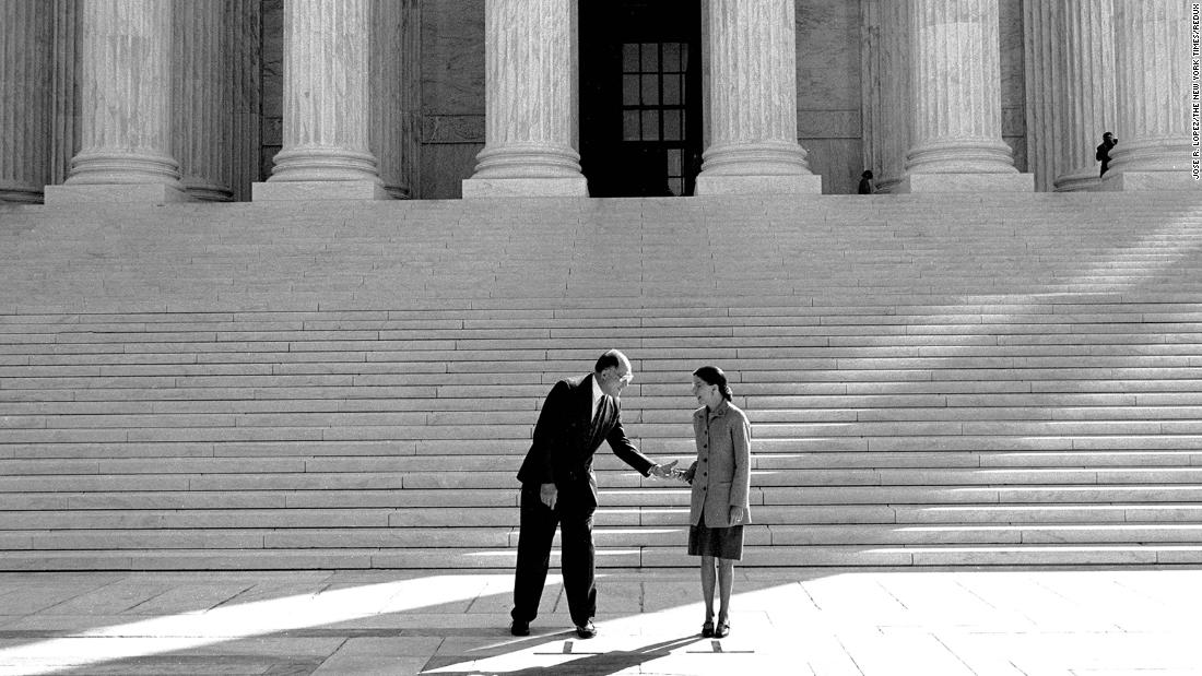 From the steps of the Supreme Court, Rehnquist introduces Ginsburg to the press in October 1993.
