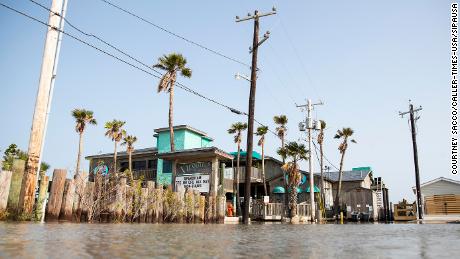 Flood waters fill a parking lot in Port Aransas, Texas on Sunday ahead of Tropical Storm Beta.