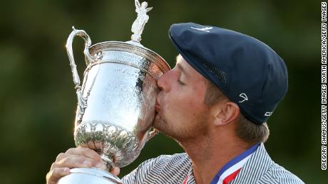 DeChambeau kisses the championship trophy in celebration after winning the 120th US Open.