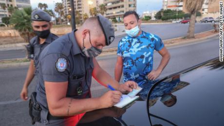 Security forces man a lockdown checkpoint in Beirut on August 21.