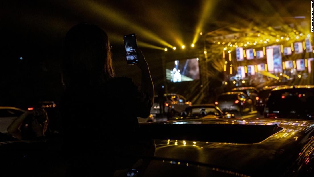 A woman watches the band Jikustik during a drive-in concert in Yogyakarta, Indonesia, on September 20.