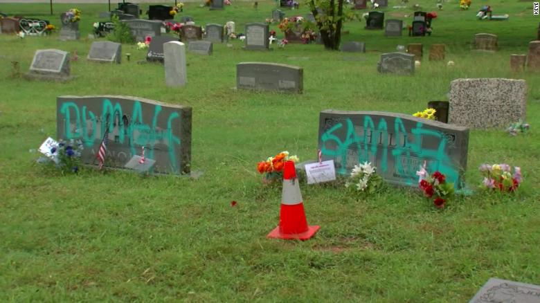 Somebody spray-painted graffiti on headstones in a historically Black cemetery in Austin, Texas