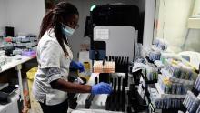 A lab assistant organizes samples for Covid-19 tests at a laboratory in Neuilly-sur-Seine, outside Paris, on September 15.