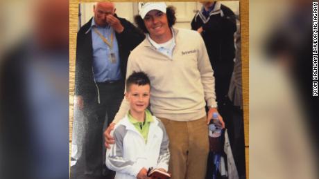 Lawlor poses with Northern Irish golfer Rory McIlroy.
